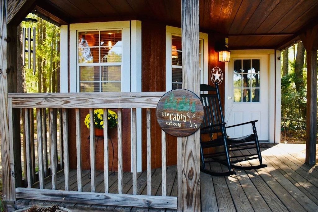 up close photo of cabin porch with rocking chair