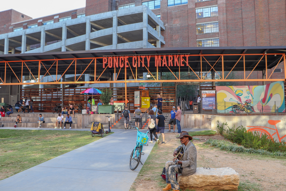 The outer banks of the Ponce City Market shows couples walking up to the indoor building, showing that it is perfect for date night in Atlanta. 