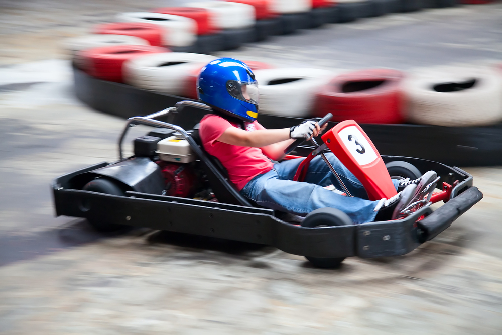 Photo of person driving go-cart at NASCAR Speed Park, one of the best things to do in Sevierville for kids. 