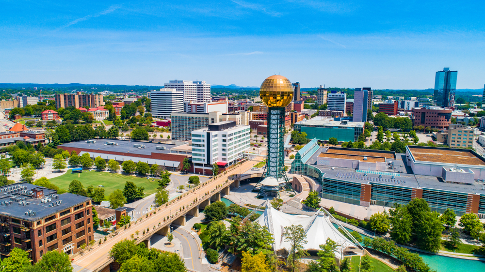 An aerial view of what is left of the World's Fair Park, one of the best things to do in Knoxville. You can see the tower, amphitheater, and other buildings. 