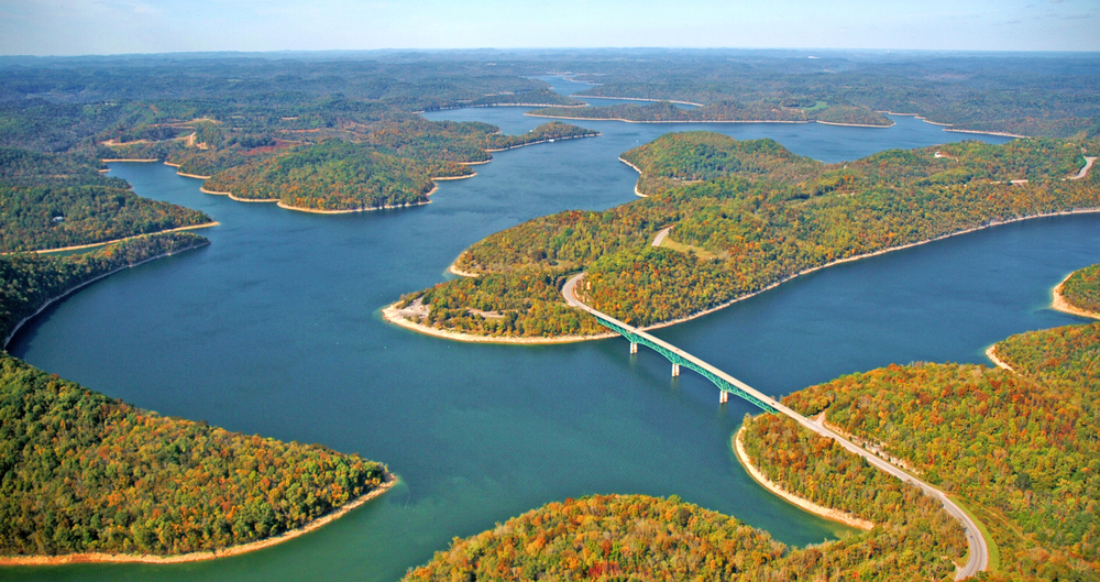 Center Hill Lake, one of the best beaches in Tennessee, has deep, blue waters, surrounded by lush foliage. Here it shows a bit of the fall foliage around the twisting lake.