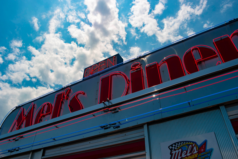 The retro neon sign for Mel's Diner where you eat all-day breakfast in Pigeon Forge.