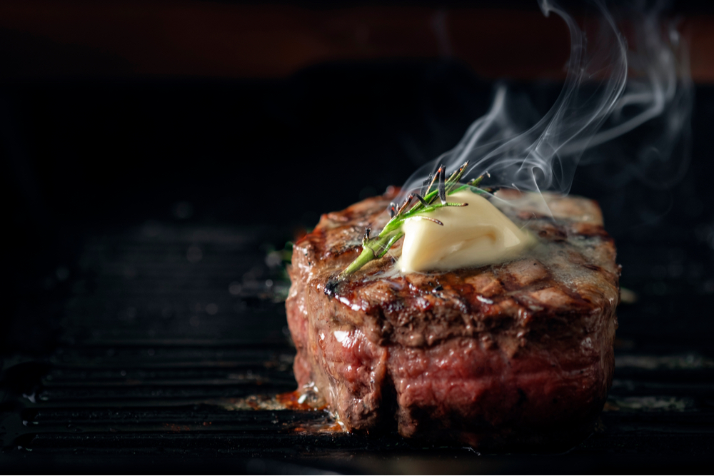 Hot and melty butter on top of prime cut of fillet mignon at the Flying Squirrel in downtown restaurants in Chattanooga