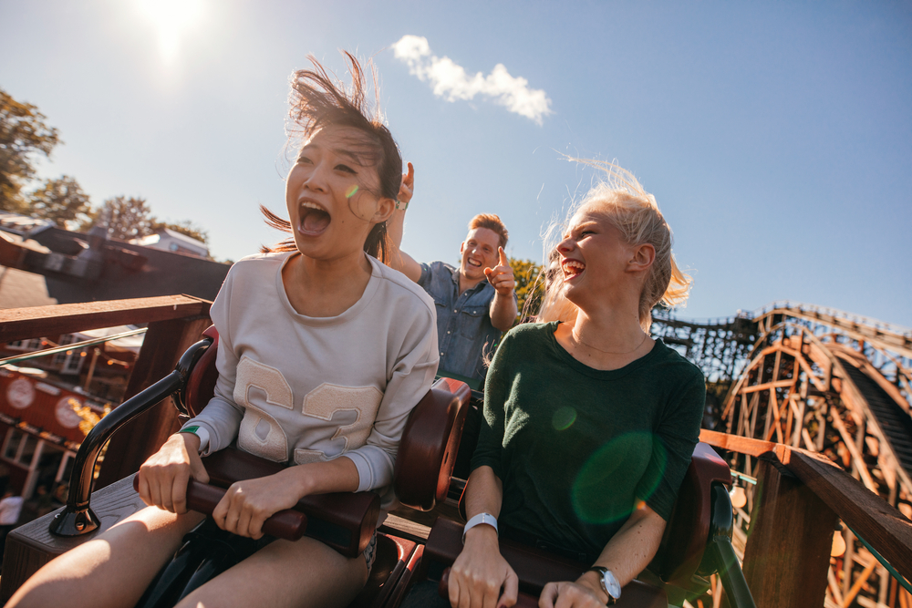 Girls screaming on wooden rollercoaster from one of the amusement parks in Georgia. 