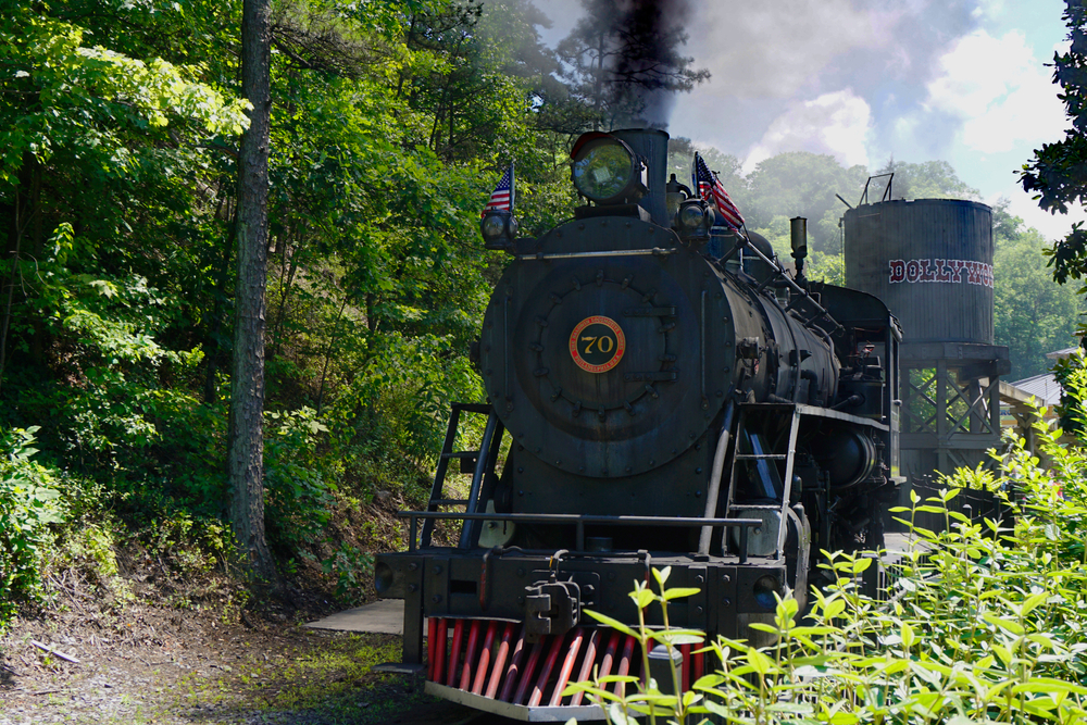 Black train on the tracks at Dollywood in Tennessee, one of the best amusement parks in the southern USA!