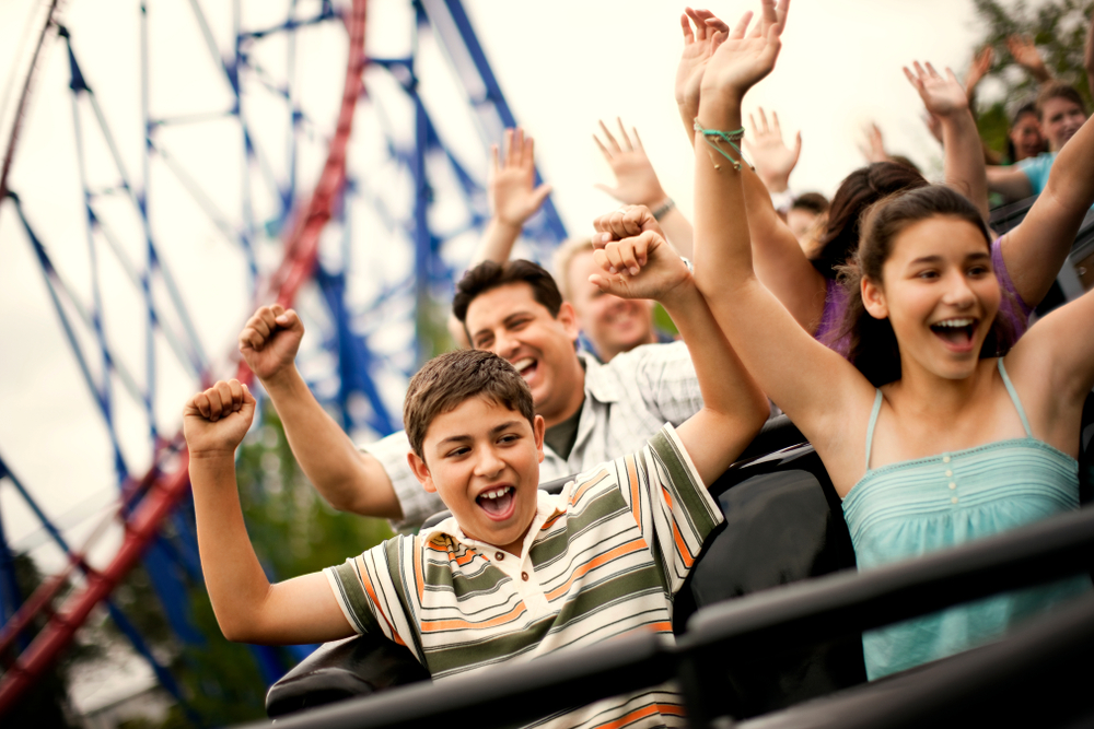 Family on a thrilling roller coaster at one of the southern amusement parks!