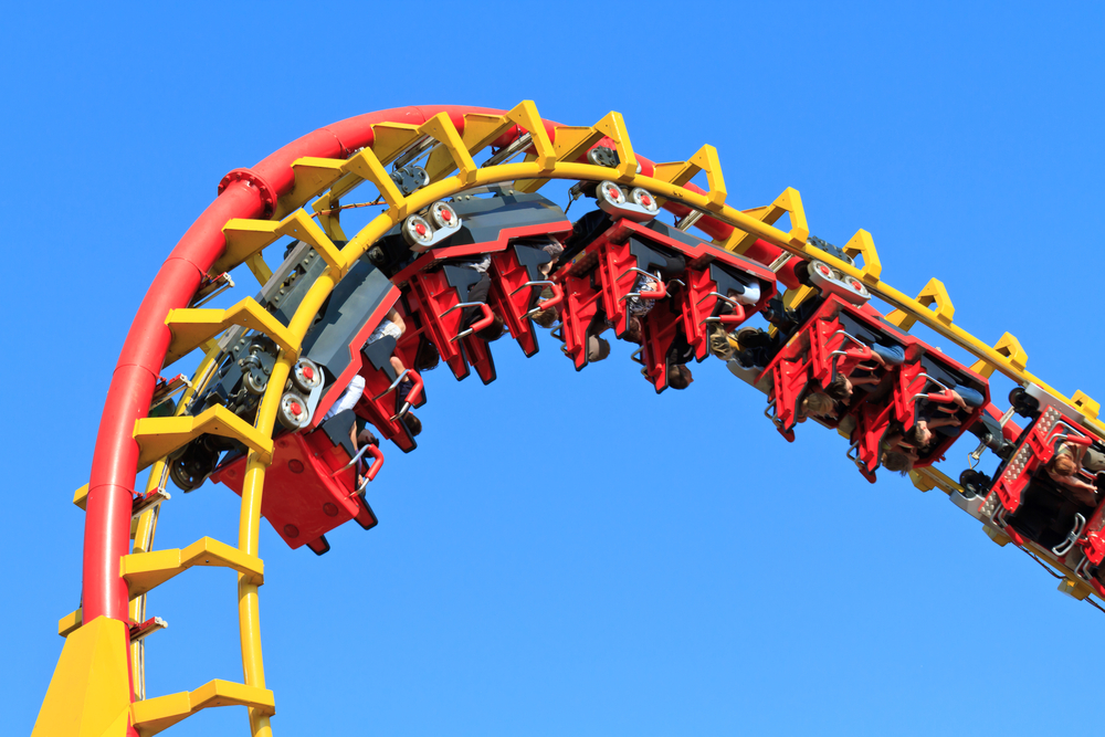 Riders doing an inversion on one of the roller coasters at one of the theme parks in the south! 