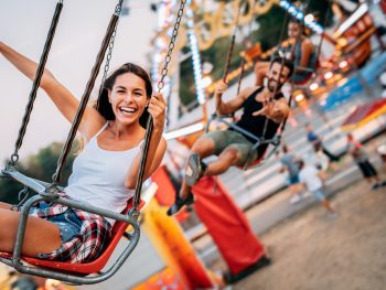 women riding on a swing ride at one of the best theme parks in the south USA