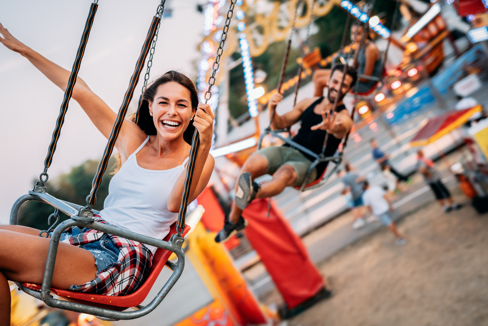 women riding on a swing ride at one of the best theme parks in the south USA