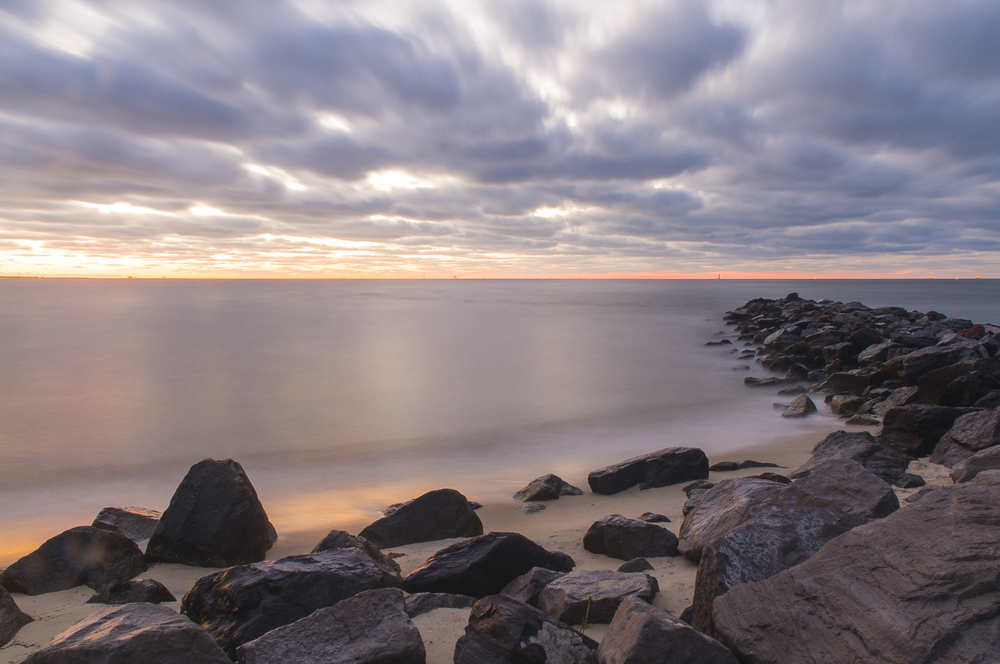 rocks along edge of beach in alabama 