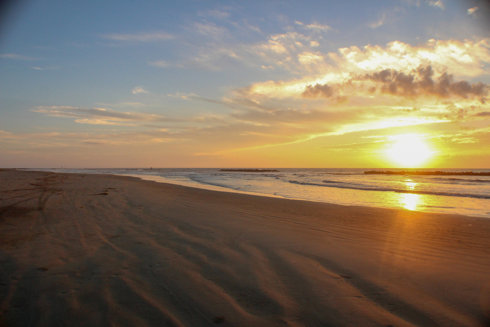 Photo of the sunset at Grand Isle beach, one of the prettiest USA Gulf Coast beaches.