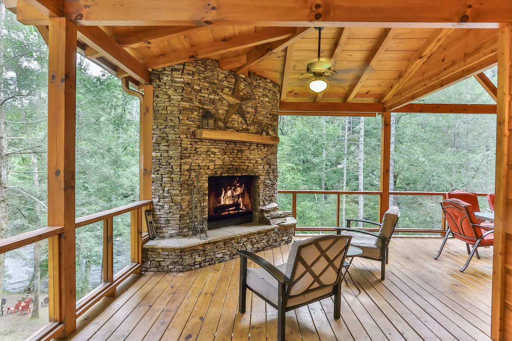 Photo of the outdoor fireplace at Waterfront Lodge, one of the best luxury cabins in Georgia. 