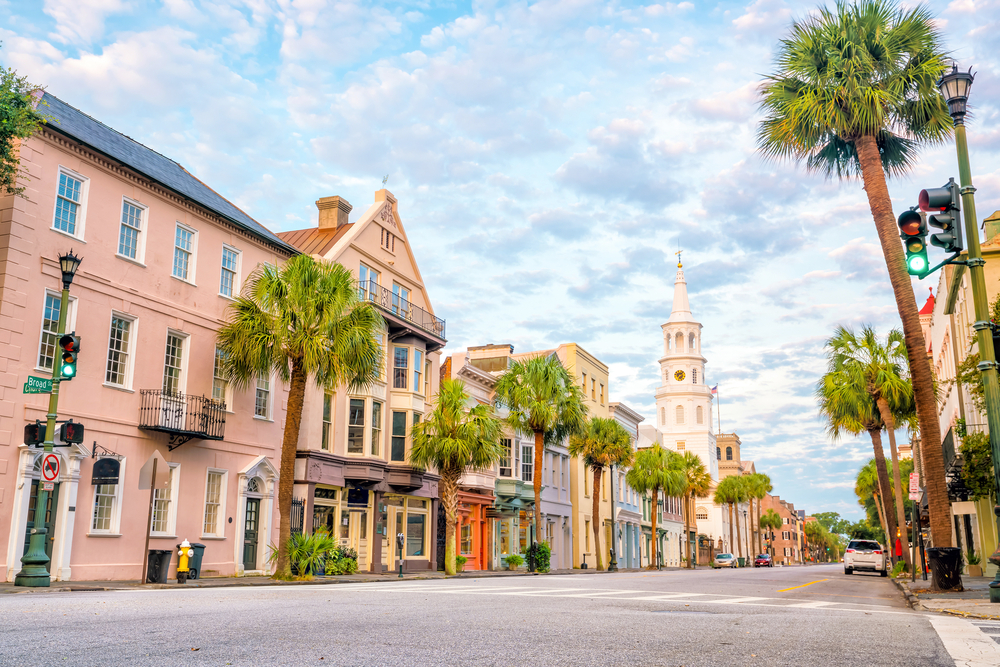 The colorful storefronts and palm trees along one of the main streets where one can have breakfast in Charleston, SC.