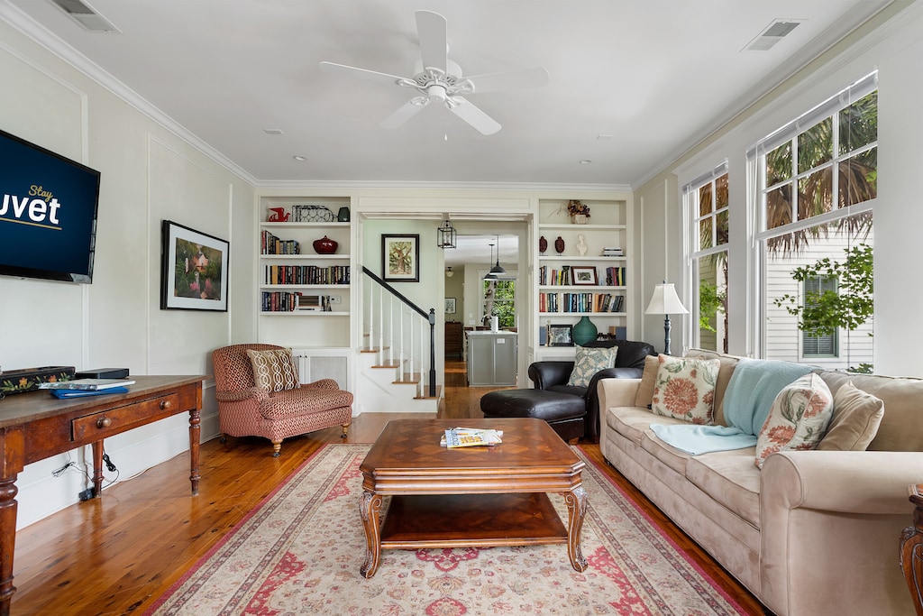 View of the cozy living room of the Rainbow Cottage, one of the best airbnbs in Charleston, South Carolina. 