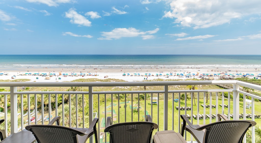 Chairs on a deck overlooking Myrtle Beach. 