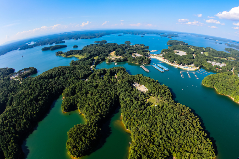 a fish eye's lens of lakes in georgia with blue waters and green trees