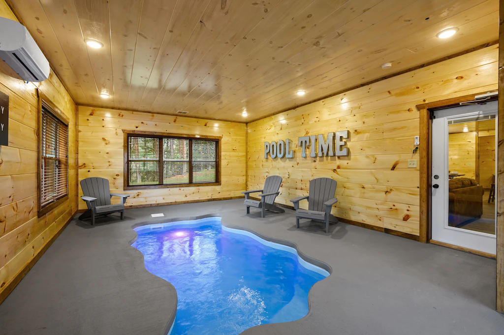 indoor pool and chairs in a one of the best luxury cabins in tennessee