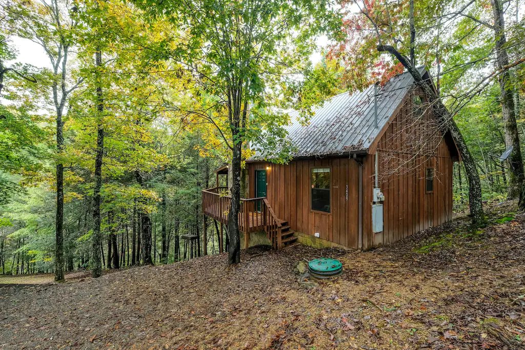 a wooded cabin with a great view off the mountain side, perfect for glamping in tennessee