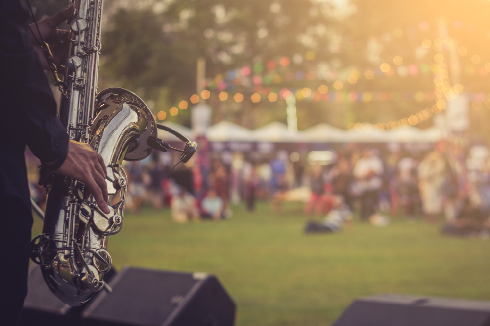 musician playing for an outdoor crowd 