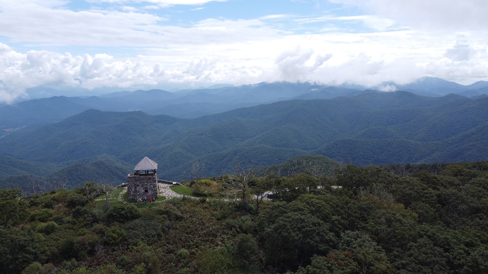 Mountain view of Wayah Bald Outlook Tower on a sunny day, one of the best things to do in Franklin, NC