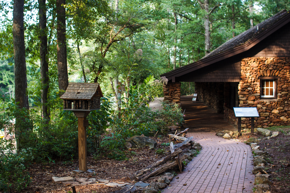 A stone house in a wooded area within Paris Mountain State Park.