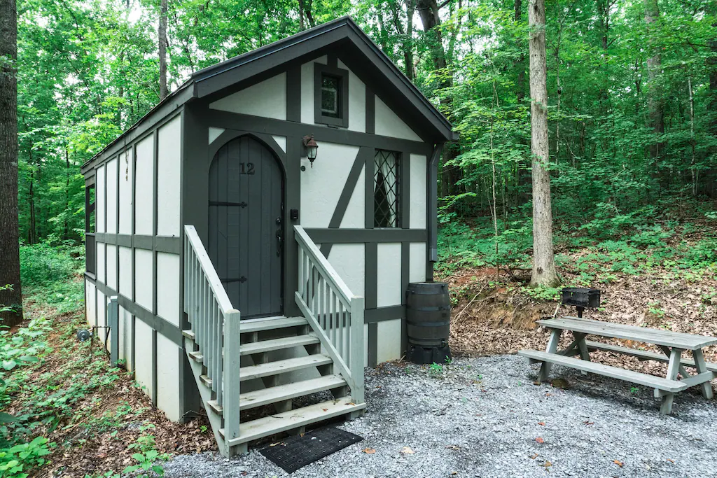 a white and grey tiny home, the perfect site for glamping in tennessee