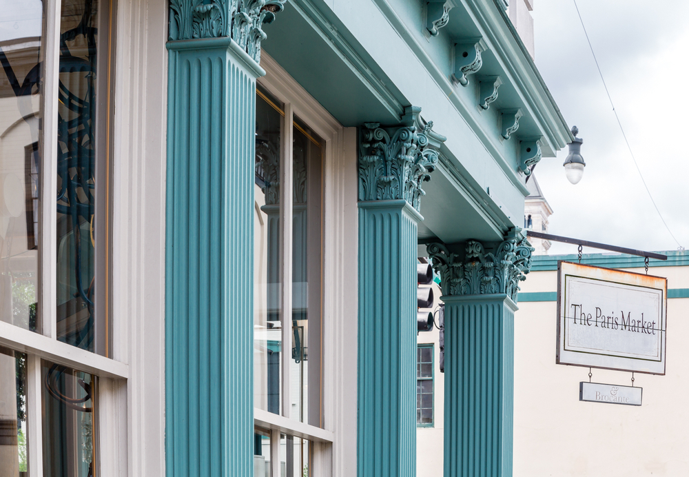 Blue columns on the exterior of The Paris Market, where antique shopping is one of the best things to do in Savannah.