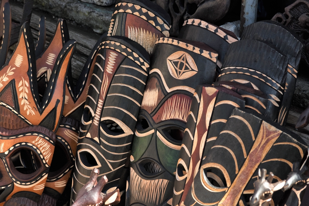 African wood painted masks in a variety of colors, shapes, and styles