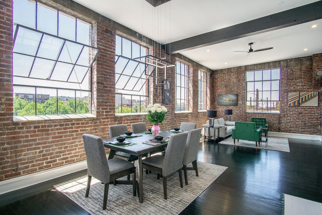 The exposed brick and amazing views of this penthouse loft. 