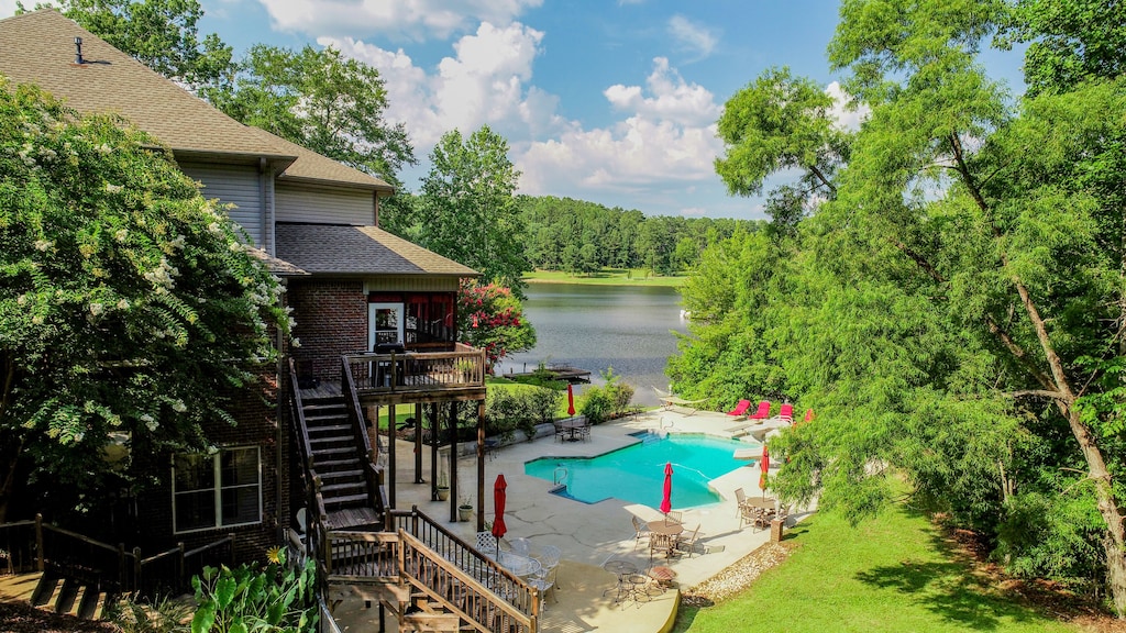 view of the epic backyard and pool of the Bama Lakeside Retreat. 