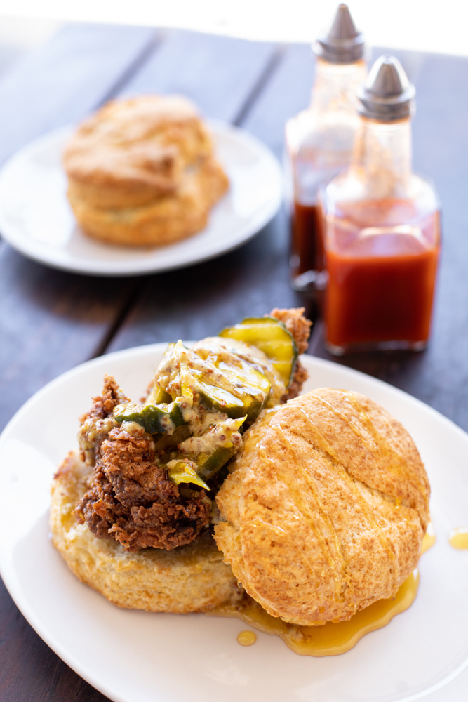 A fried chicken biscuit with hot honey at one fo the places to eat breakfast in Nashville