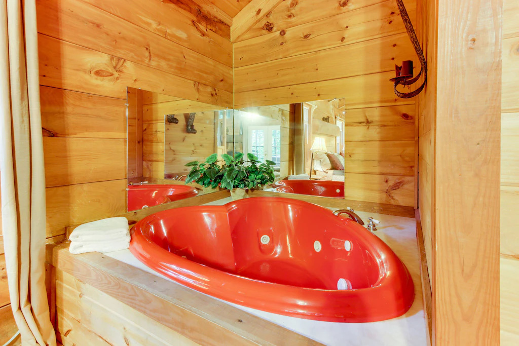 Photo of the heart shaped jacuzzi tub at Country Cottage, one of the best romantic getaways in Georgia. 