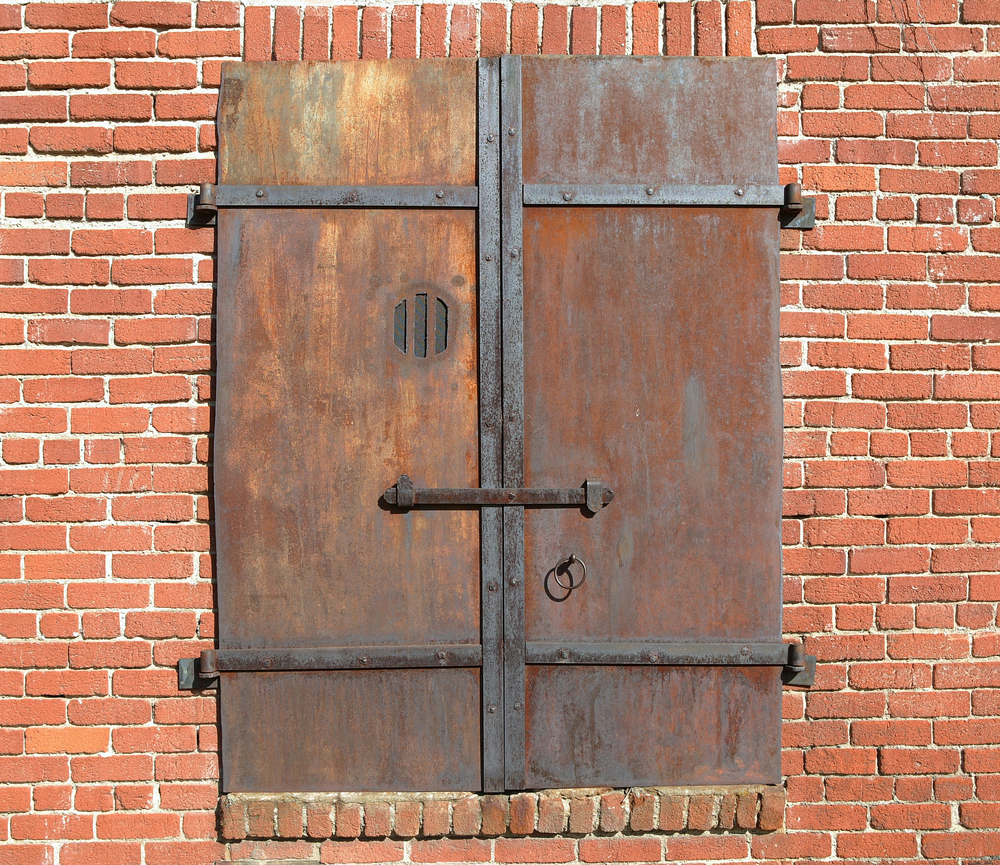 Two old metal doors with a hole cut out that were used as speakeasy doors. It is similar to things you can see in museums in Savannah. 