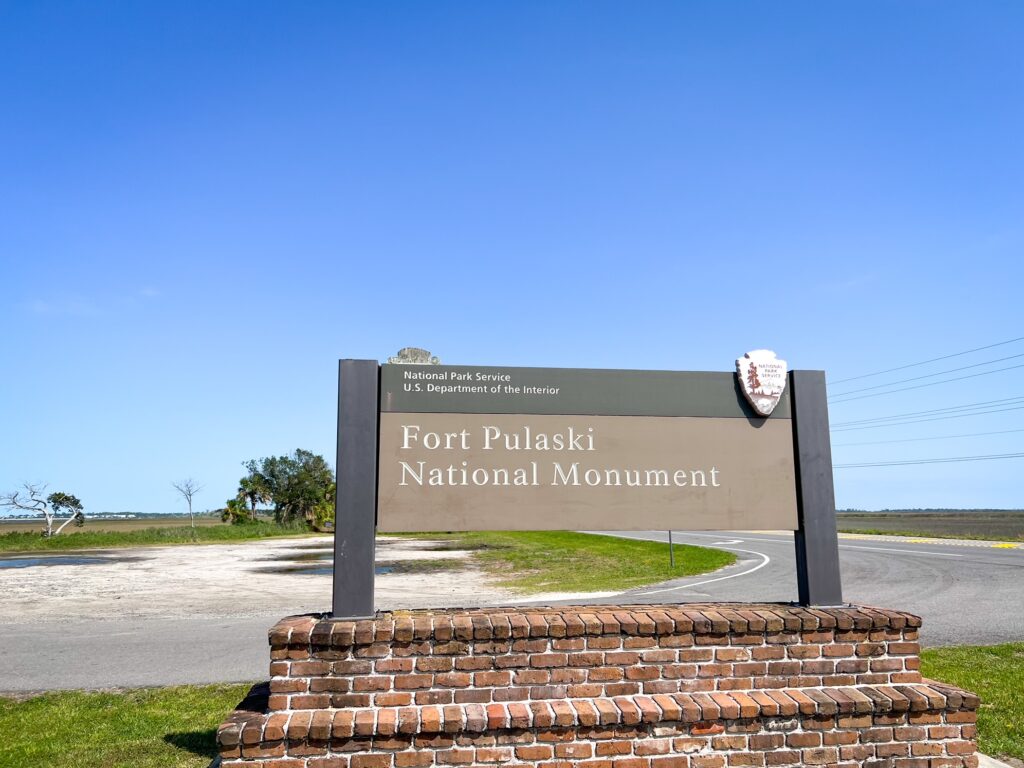 The sign for the Fort Pulaski National Monument visiting here is one of the things to do in Tybee Island 