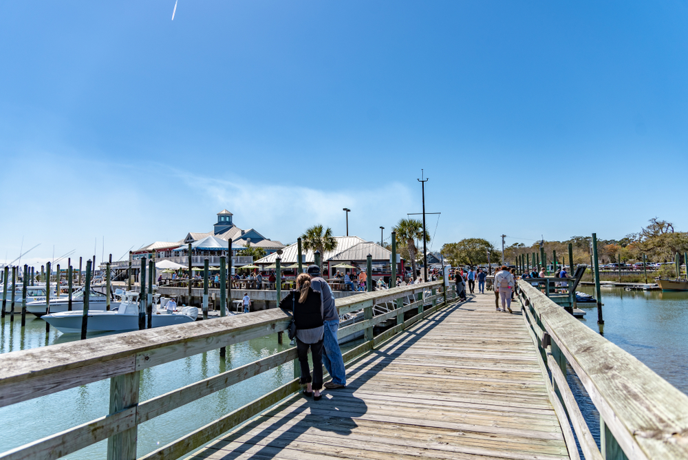 At the pier of Murrells Inlet, guests line the fishing docks of this popular fishing village, watching the boats and enjoying the restaurants. There is a reason this place is known for its seafood out of all beach towns in South Carolina. 