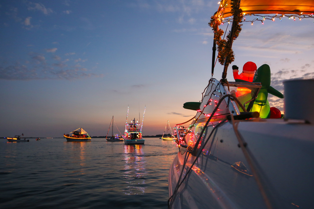 boats in the water with lights and decorations on them 