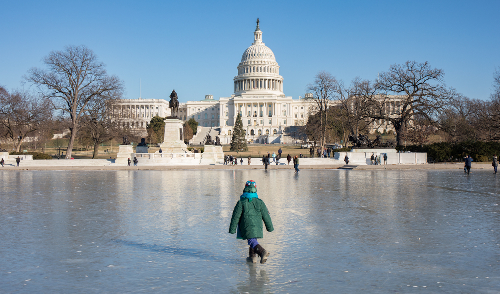 People ice skating on the National Mall near the Capitol Building during Christmas in Washington DC