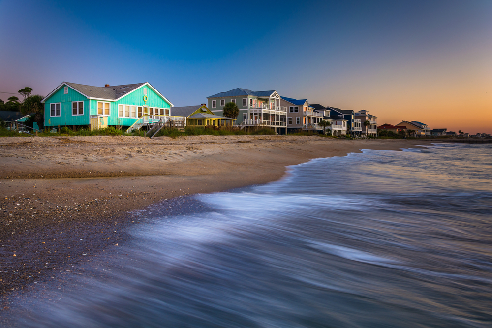 photo of beach houses along the shoreline at sunset on edisto island, one of the prettiest islands in South Carolina 