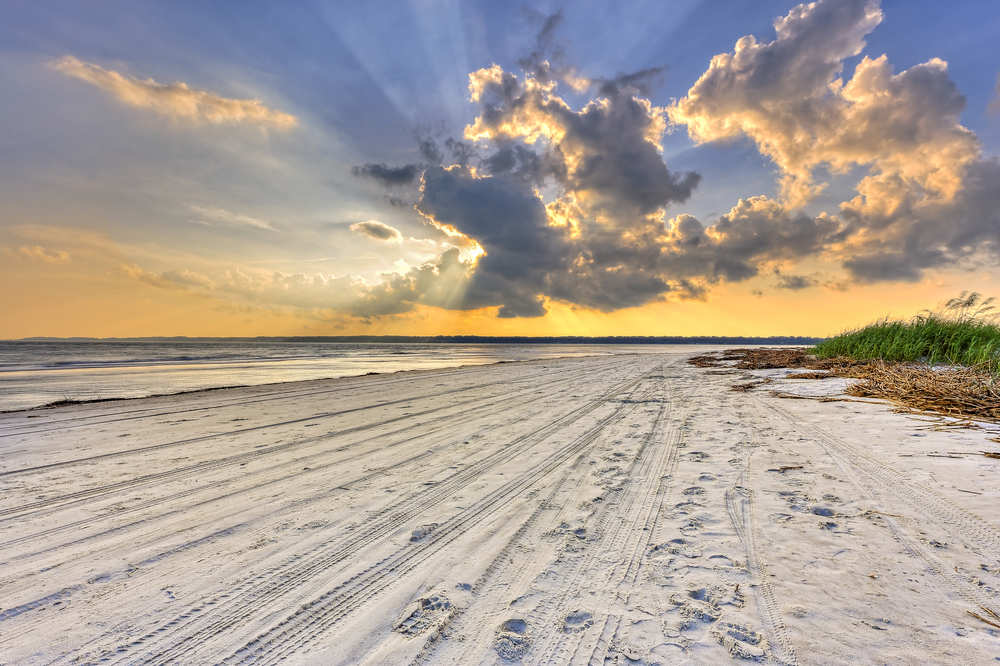 photo of Hilton head island, one of the prettiest islands in South Carolina with the sun behind the clouds
