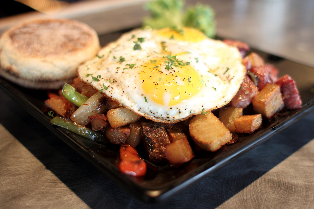 fried egg with corned beef hash and English muffin