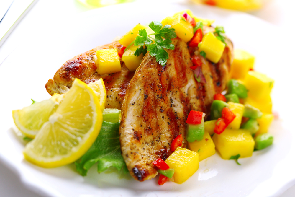 chicken dish topped with mango salsa
