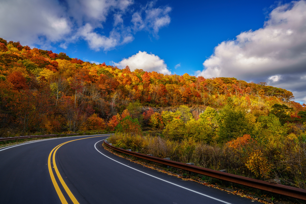 The Cherohala Skyway, ideal for romantic getaways in Tenneseee, the road bends through the woods in fall colours