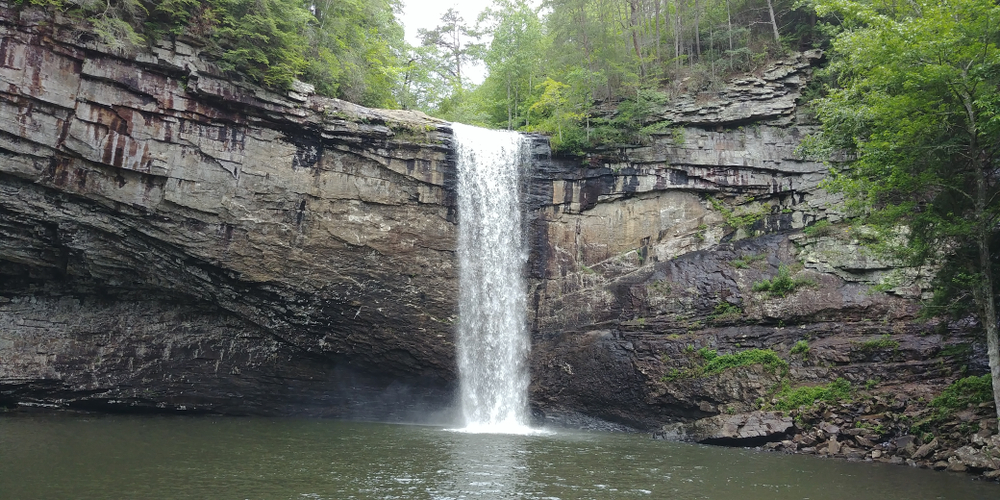 The Foster Falls waterfall and surrounding forest. South Cumberland State Park is a great place for romantic getaways in Tennessee.