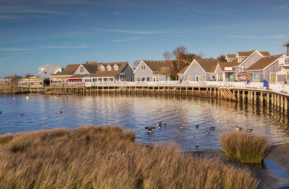 Waterfront shops and boardwalk along the Currituck Sound in Duck, North Carolina on the Outer Banks.