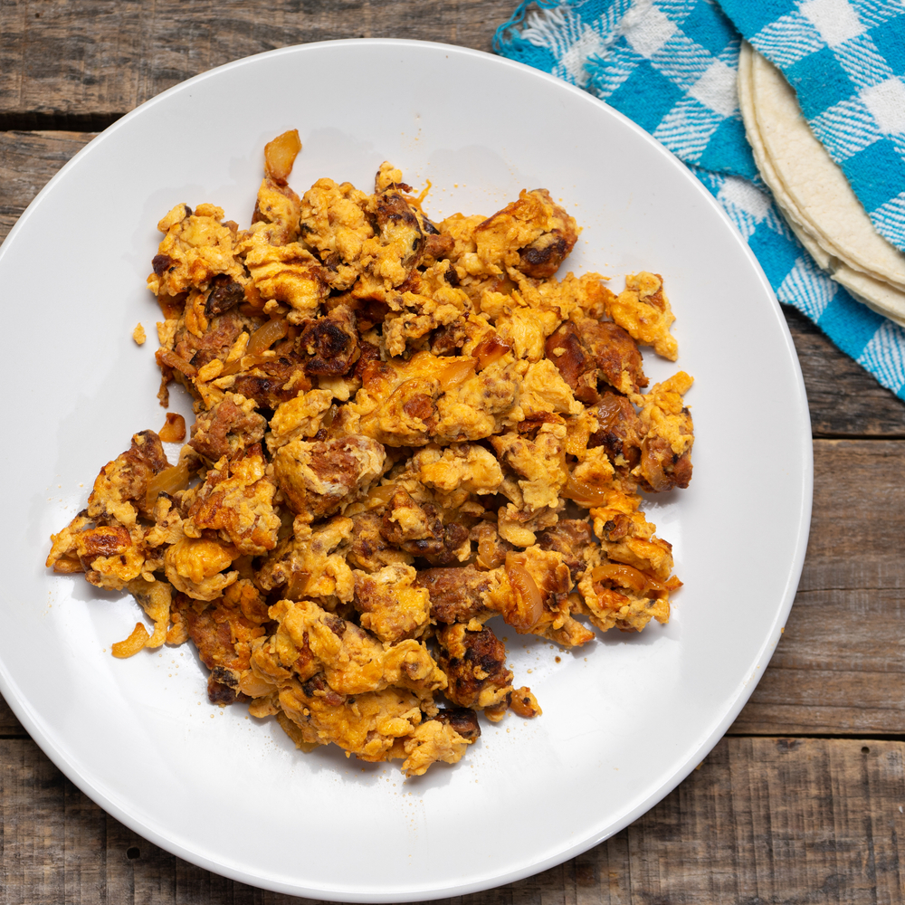 Huevos con chorizo - a traditional Mexican dish of scrambled egg mixed with chorizo and served with tortillas