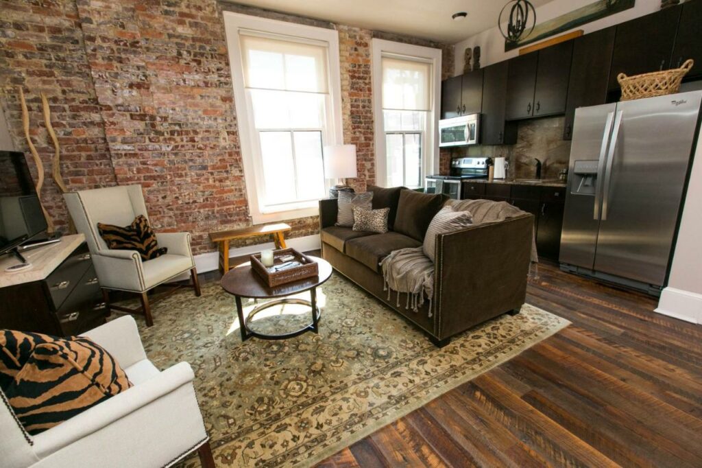 exposed brick wall, big windows and modern kitchen, a feature at one of the best boutique hotels in Asheville