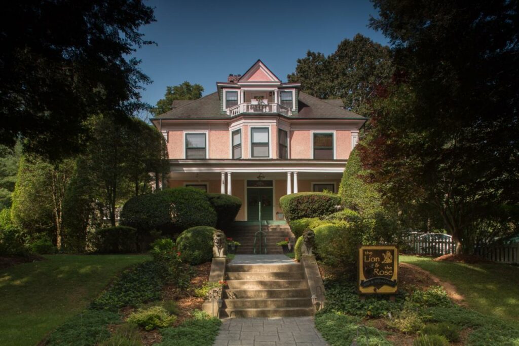 A quaint pink house, the location of the Lion and the Rose BNB, one of the best boutique hotels in Asheville