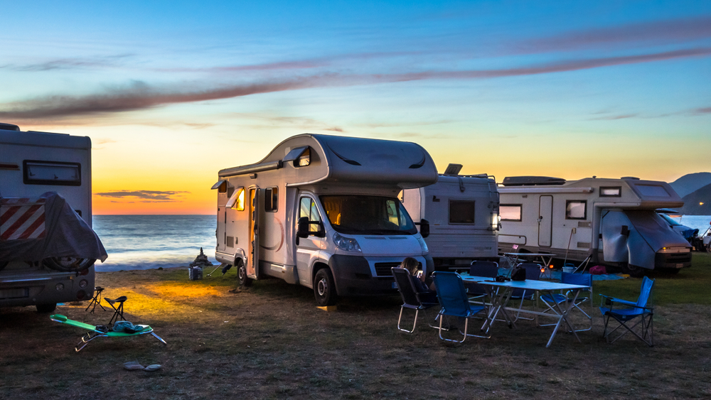 Photo of RVs on the beach during sunset at North Beach Campground, one of the best Outer Banks Campgrounds