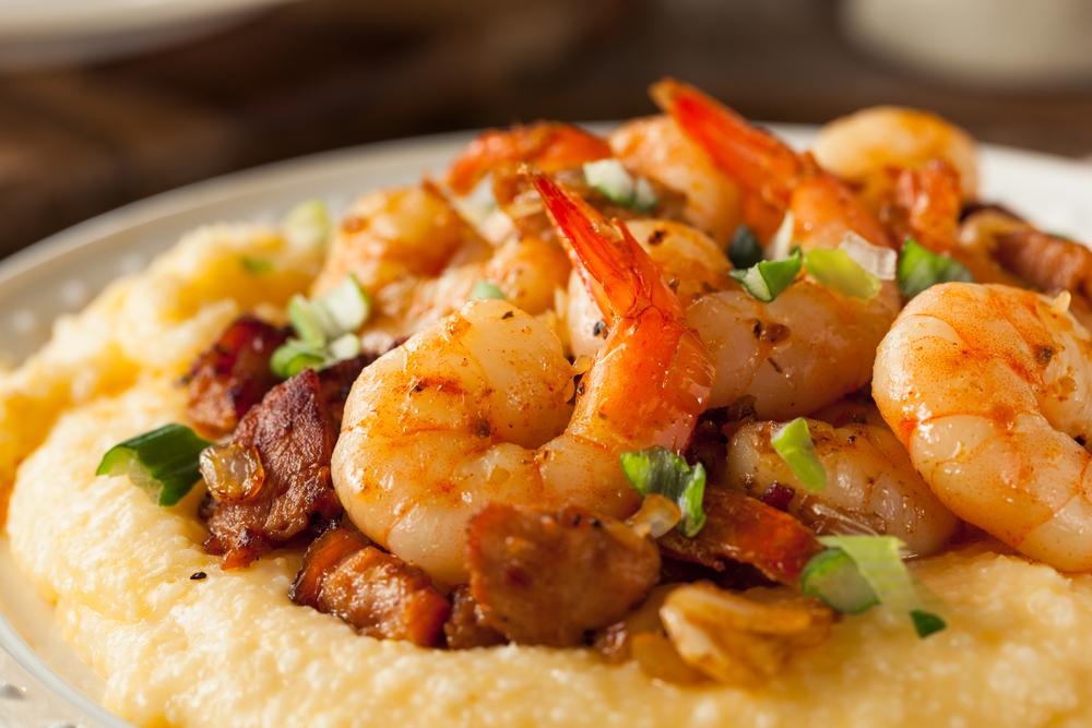 up close photo of shrimp and grits  in a bowl