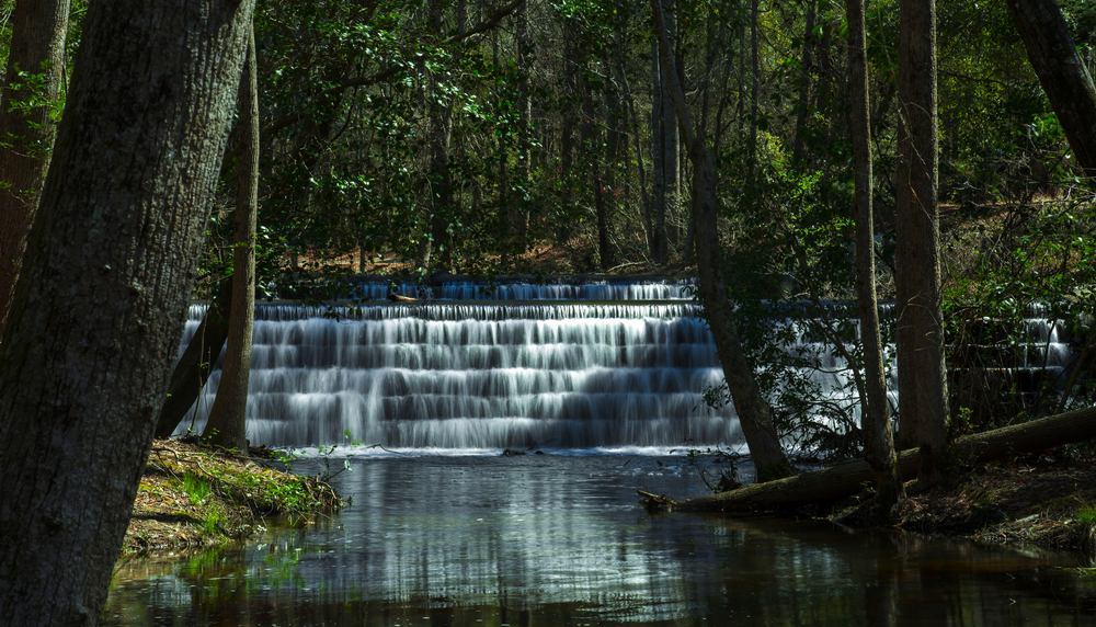 tiered waterfall in the woods of a state park, one of the best things to do in columbia SC